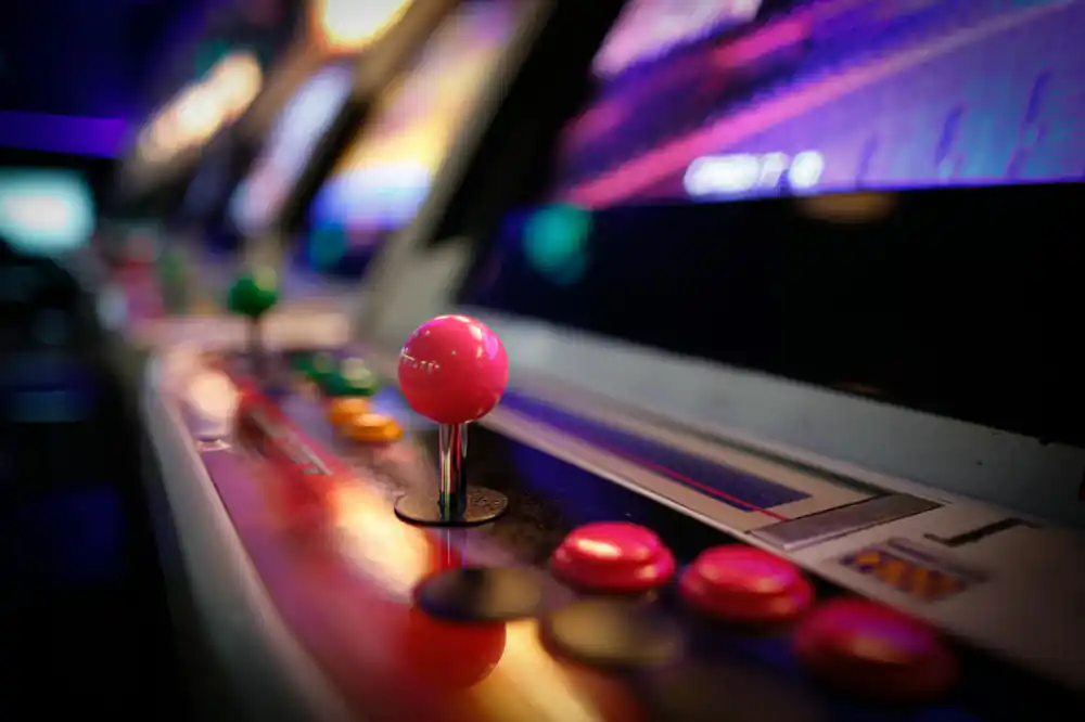Atmospheric view of retro arcade machines in a museum setting